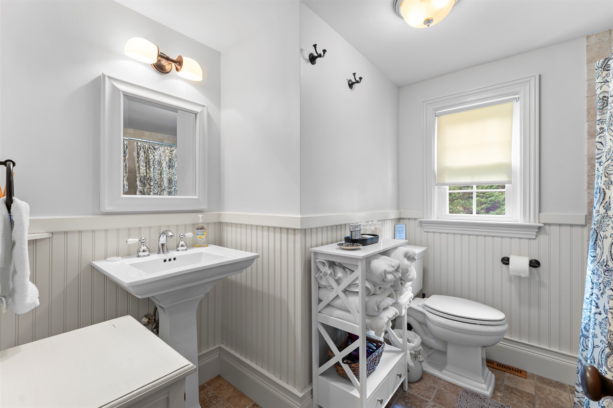 A cozy, clean bathroom with fresh towels waiting for you.