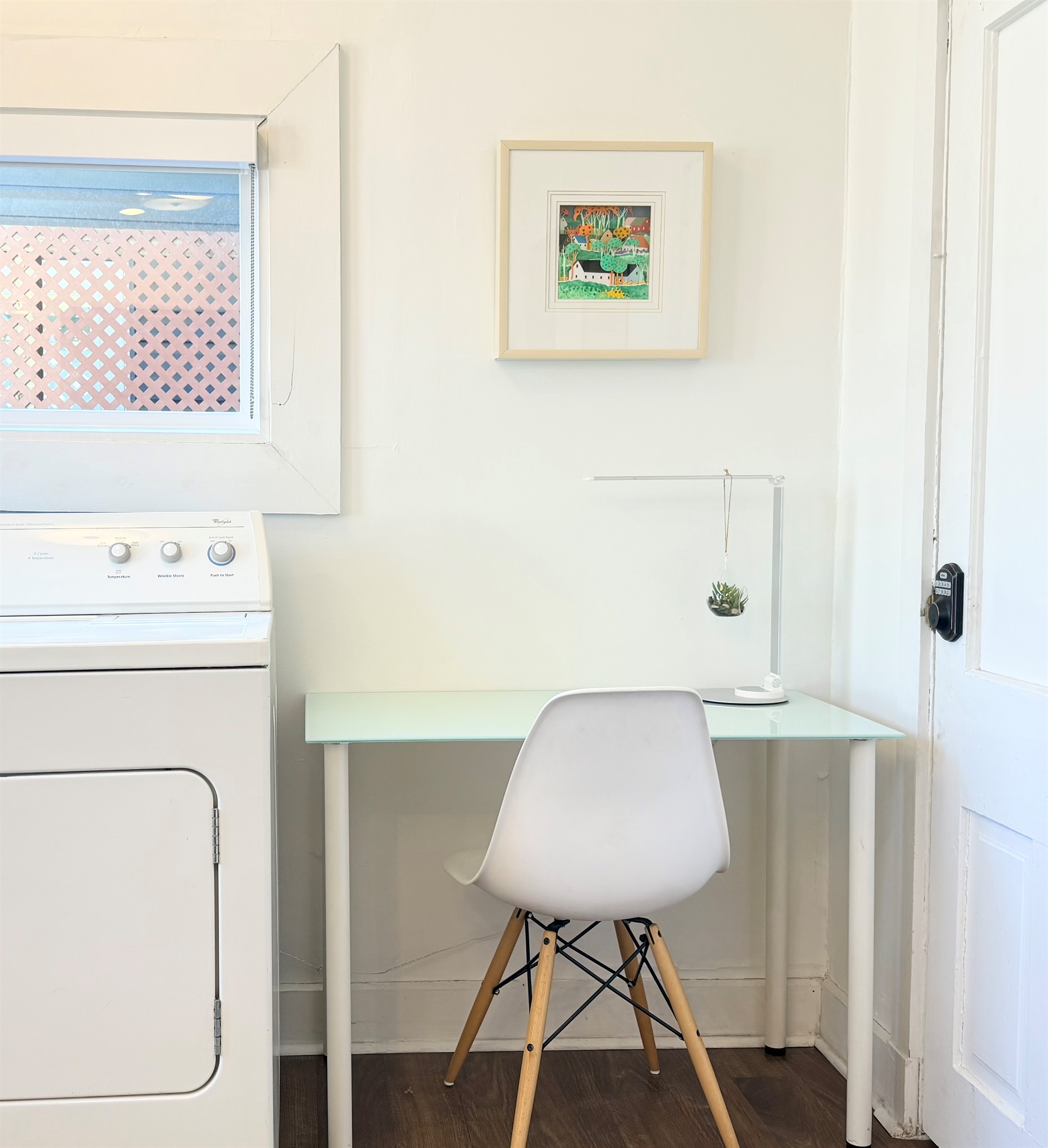 A thoughtfully designed workspace in the kitchen — the sunniest room of the home — with garden views and easy outdoor access for fresh-air breaks between calls.