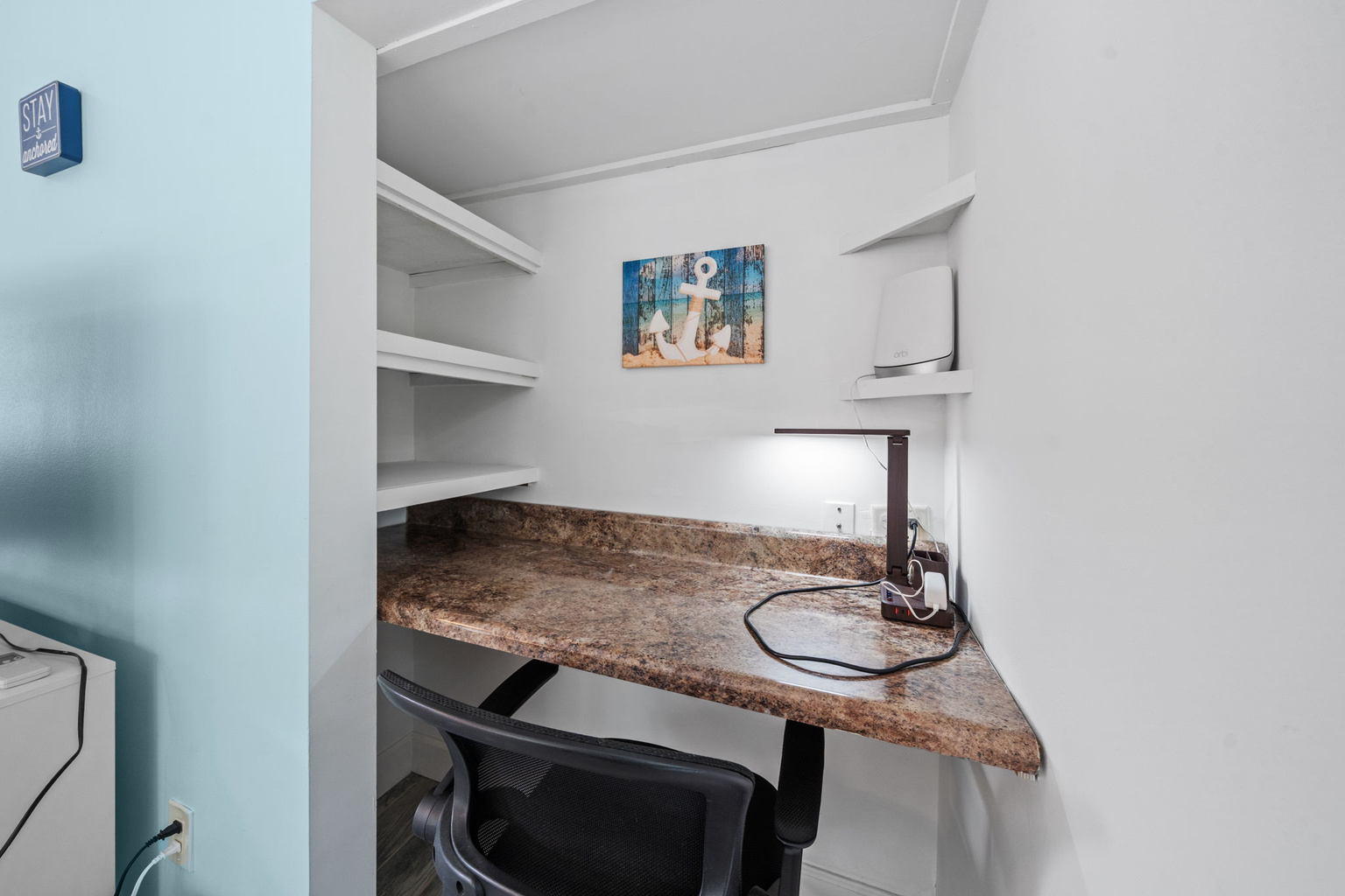 Dedicated workspace with built-in desk and shelving