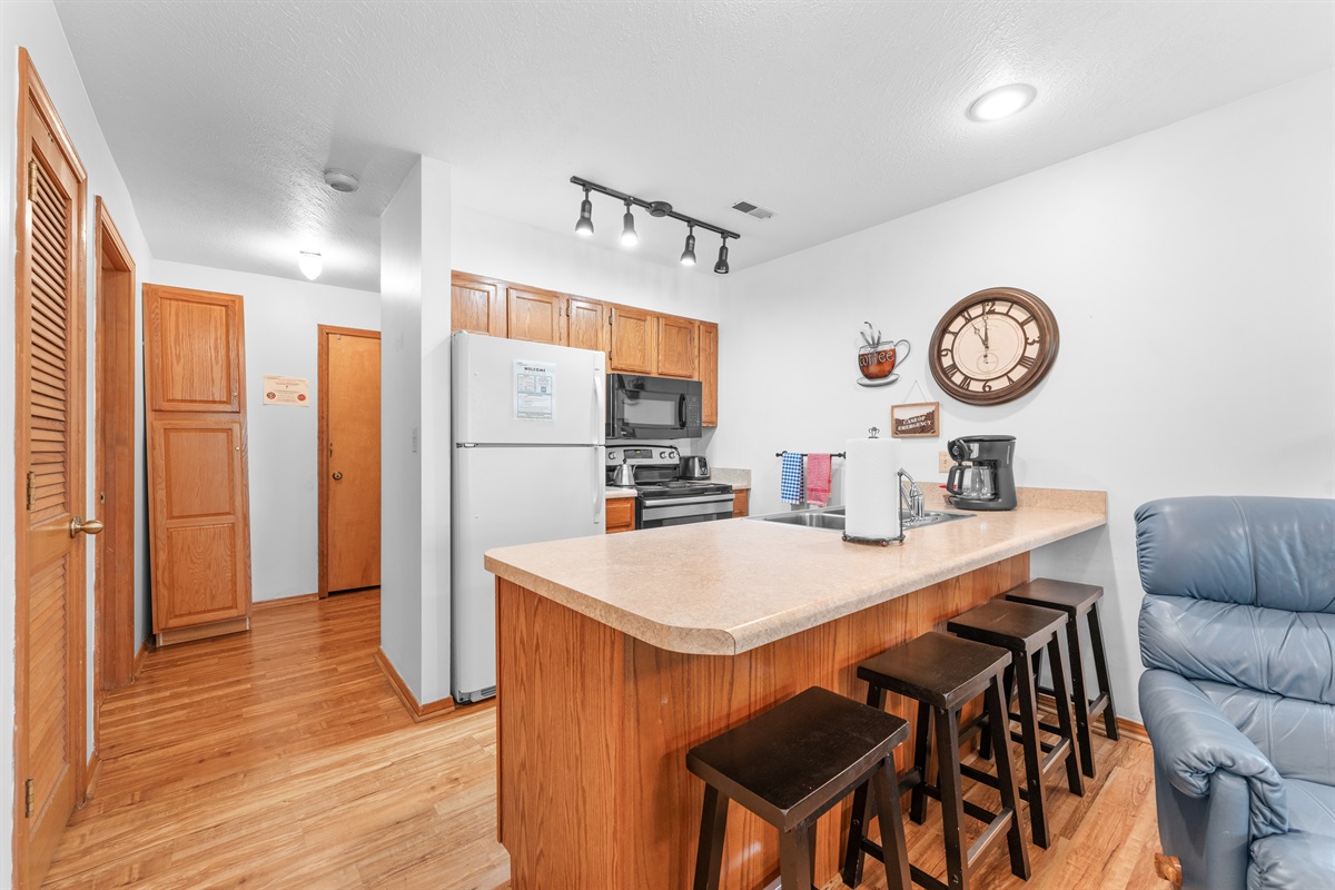 Bar seating for four makes quick breakfasts, takeout nights, and card games easy.