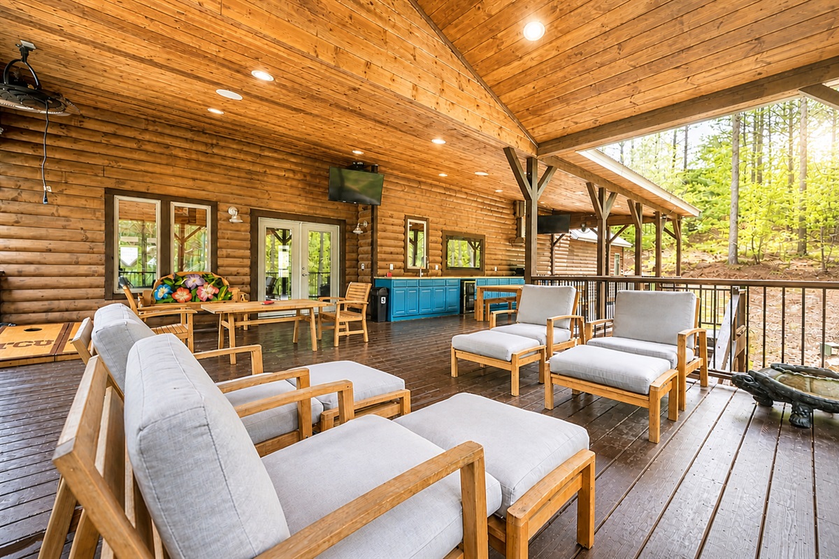 The top patio level has plenty of seating - and your first glimpse at the outdoor kitchen.
