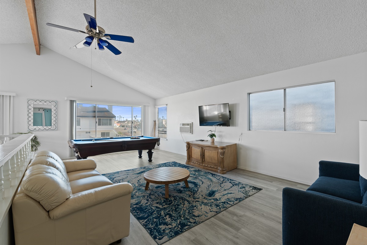 Open living space with pool table and plenty of room to relax