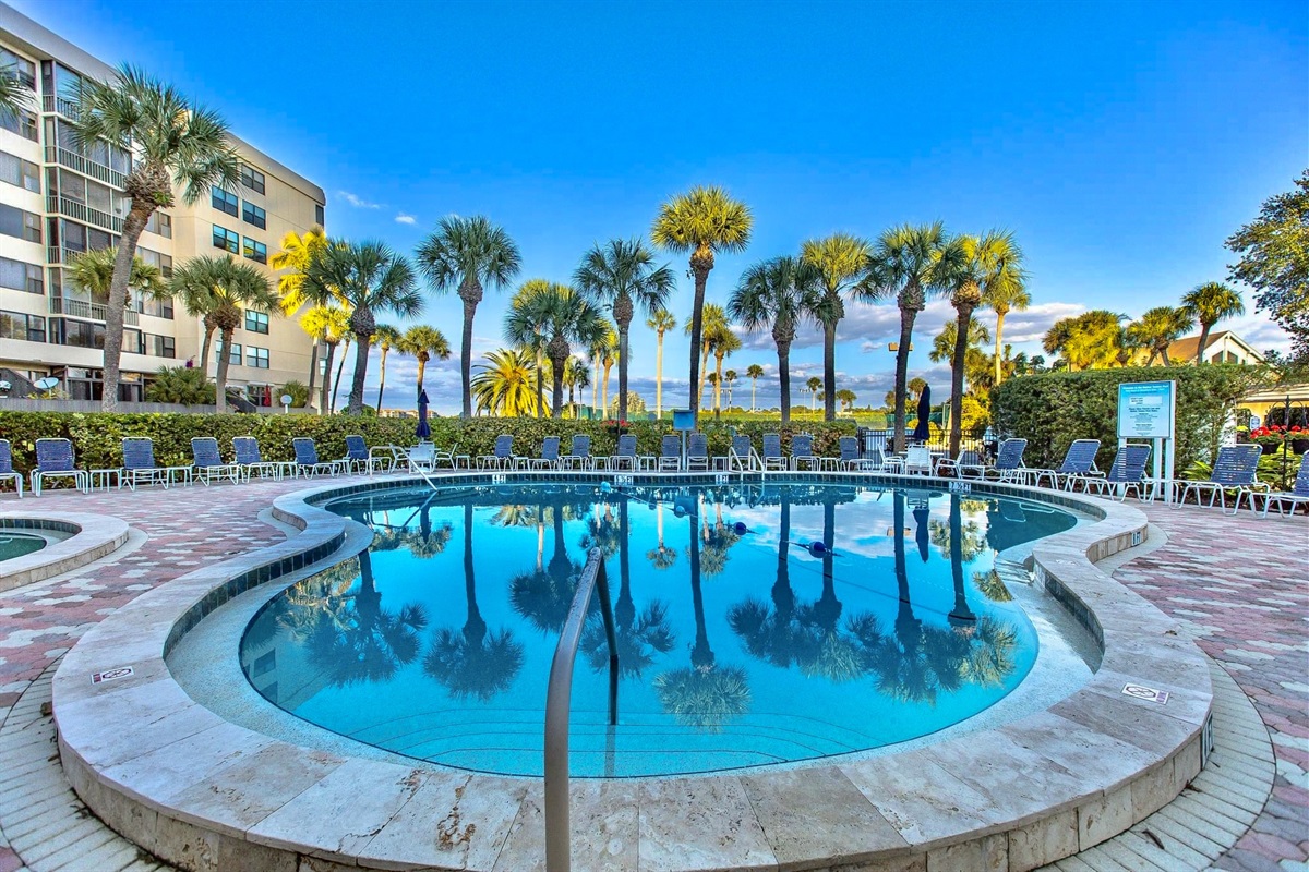 Resort-style pool surrounded by lush Florida landscaping.