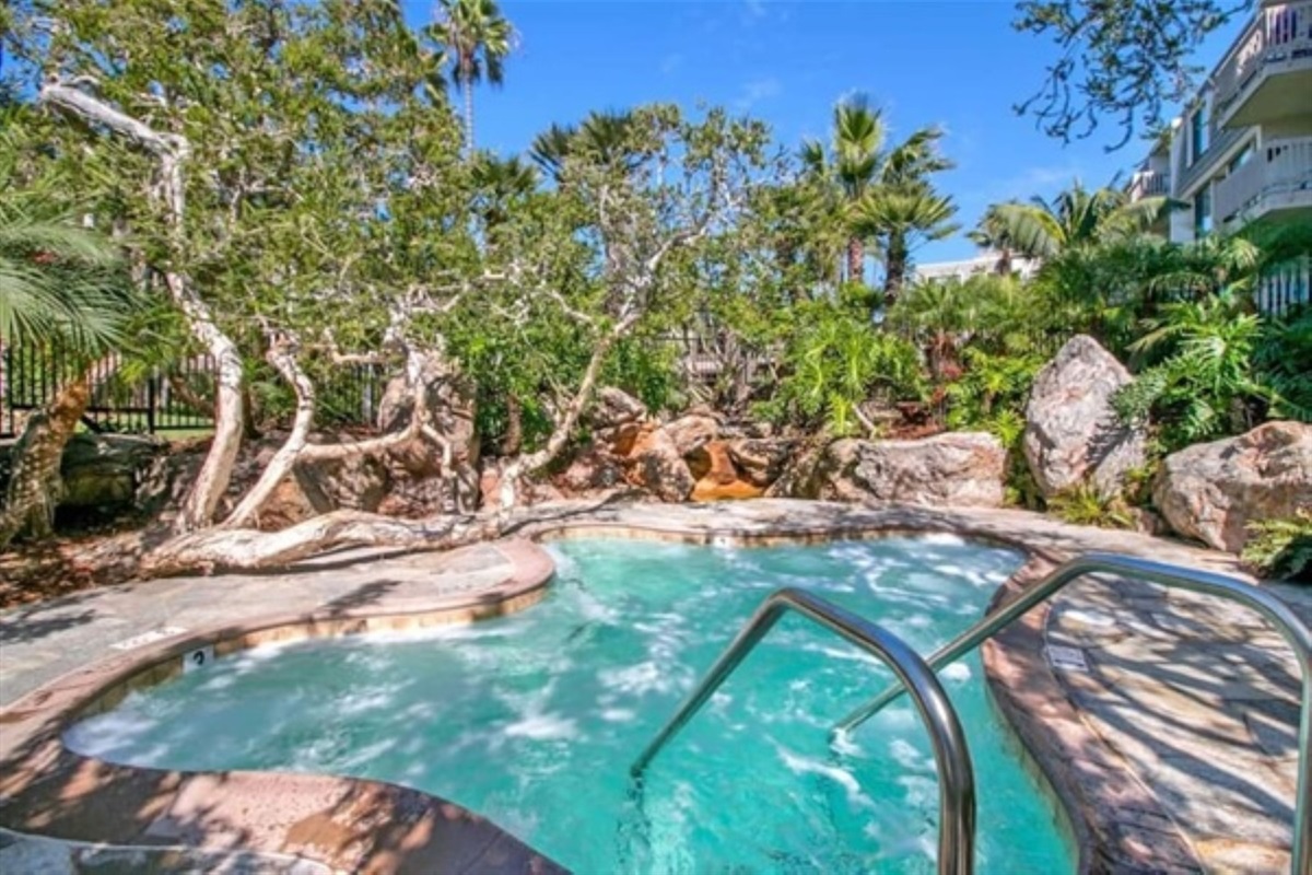 giant jacuzzi nestled in the tropical landscaping.