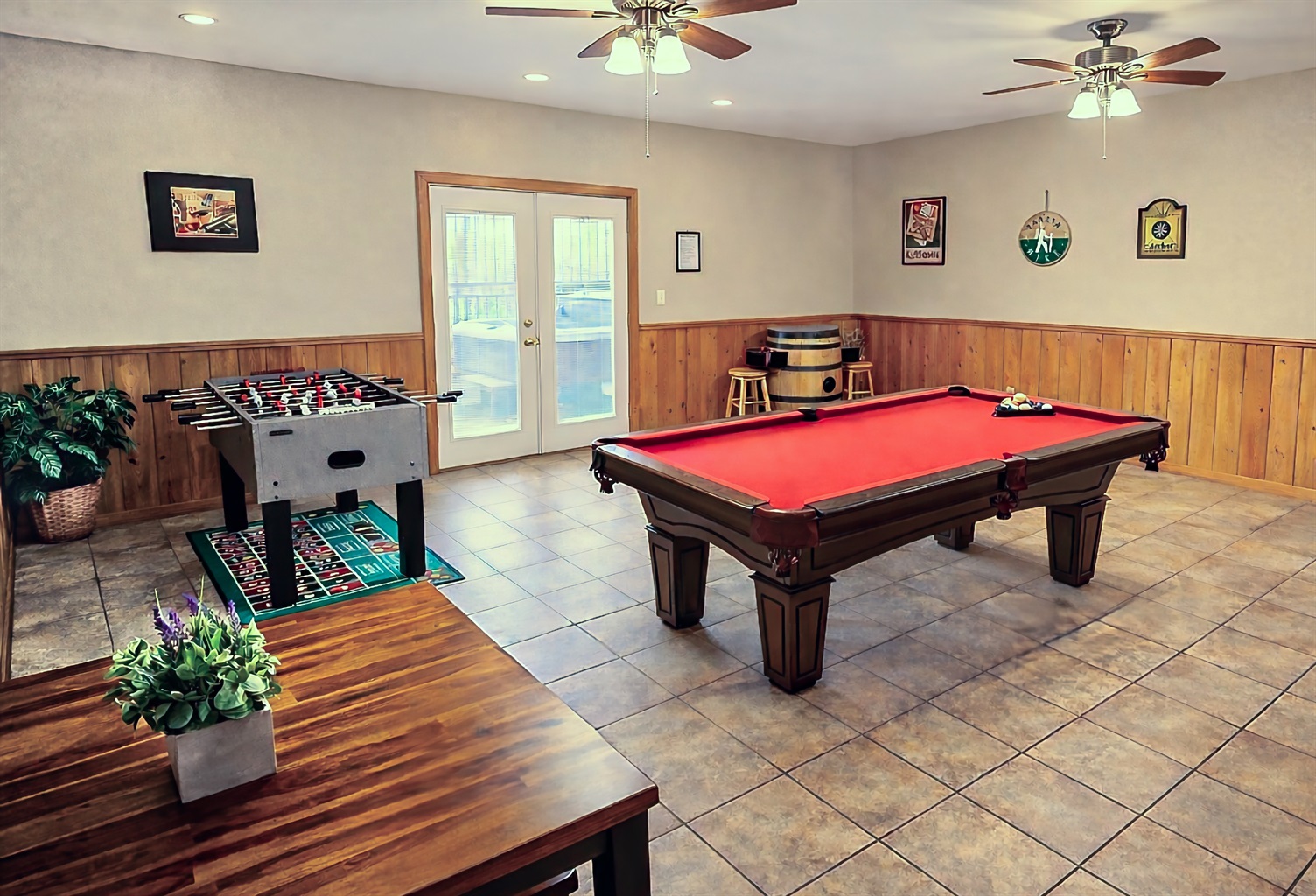 In the game room, you can find a billiards table, video arcade system, foosball, large HDTV, and a pub table perfect for card & board games.