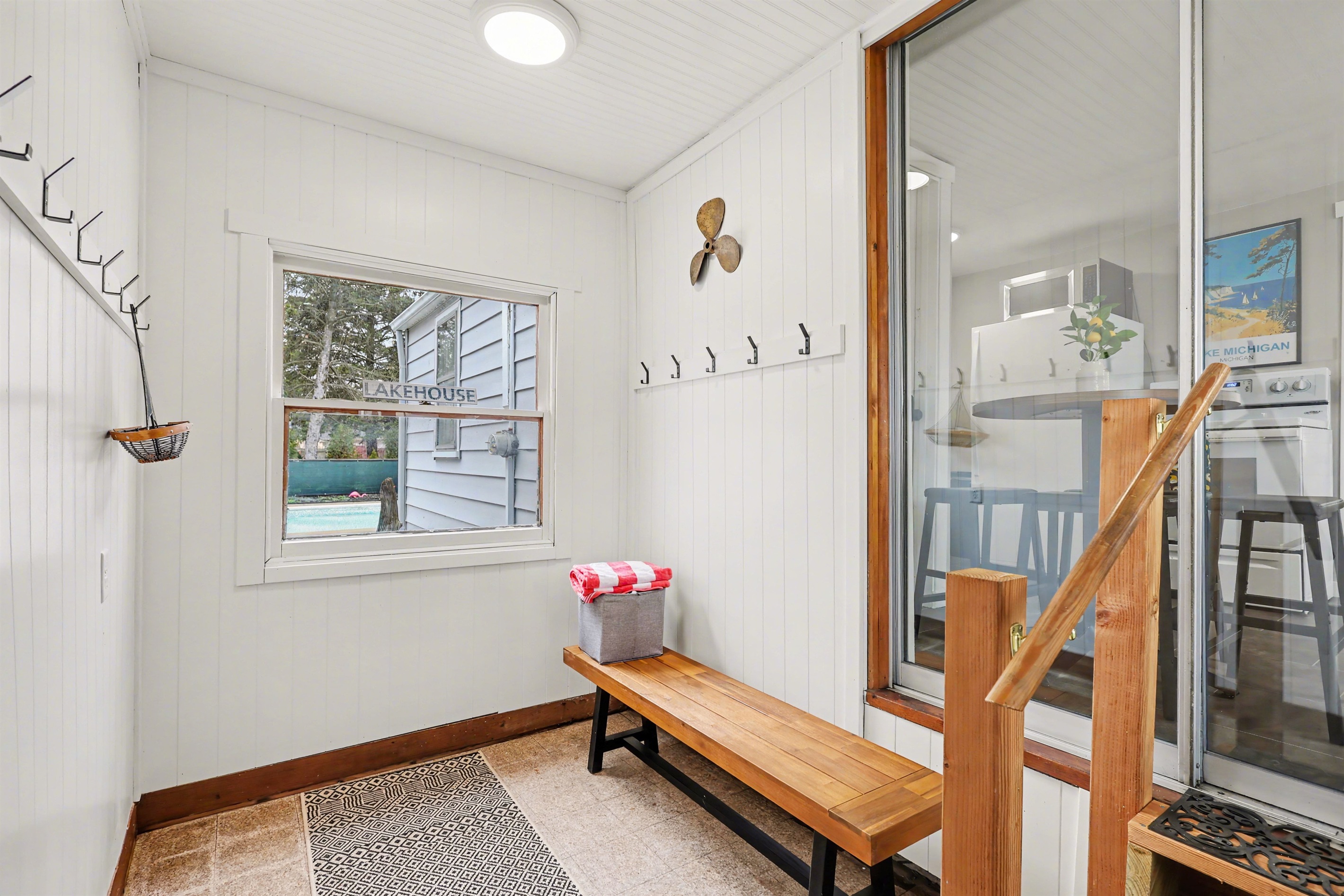 Coat, breezeway area, slider into home.