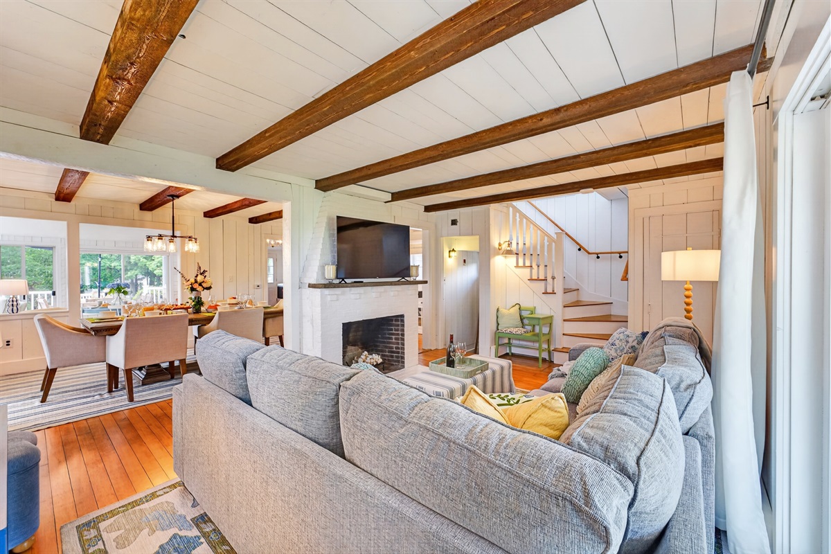 Warm and welcoming living space combining a fireplace and TV, designed for both relaxation and enjoyment.