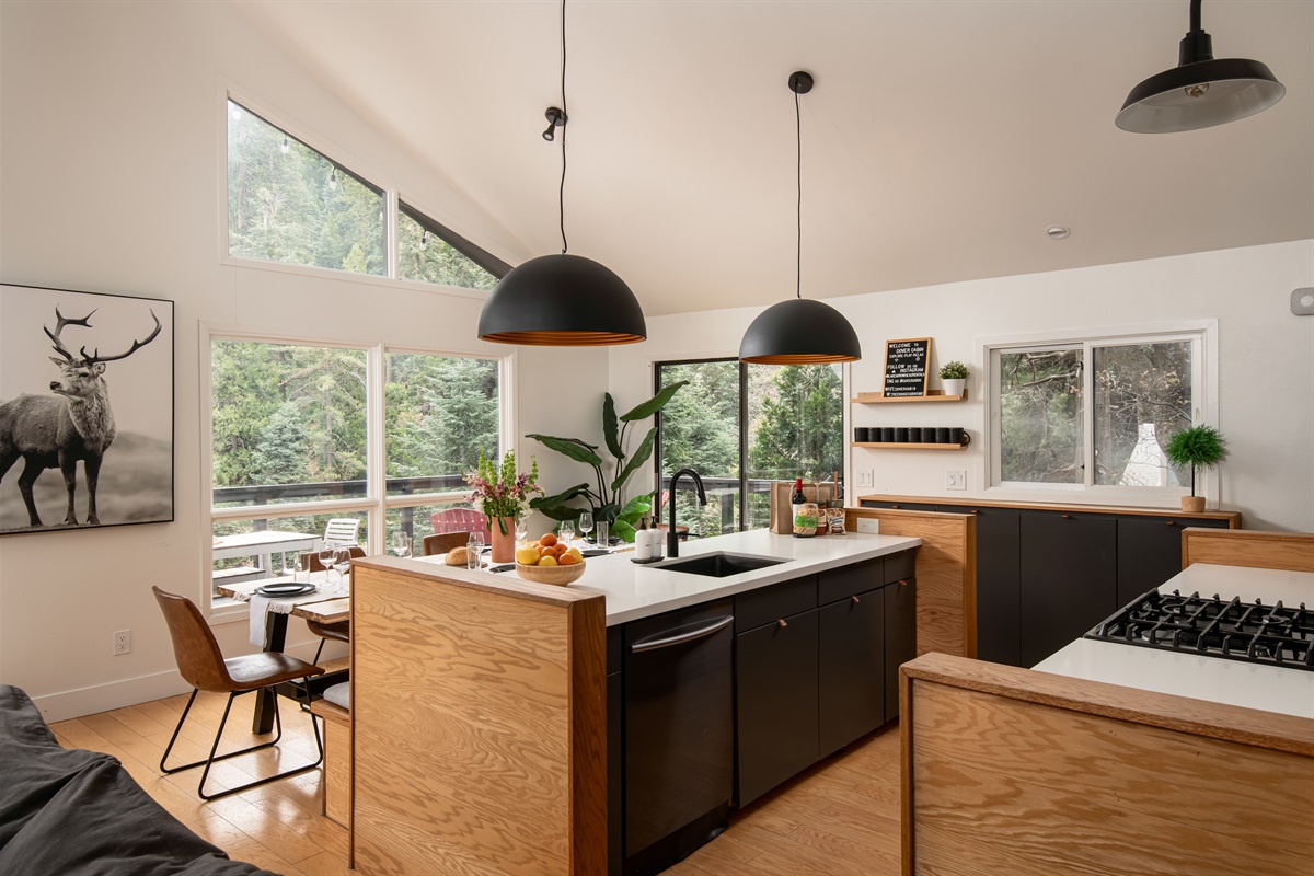 Natural light and wooded views from the kitchen and dining area—bringing the outdoors into every meal.