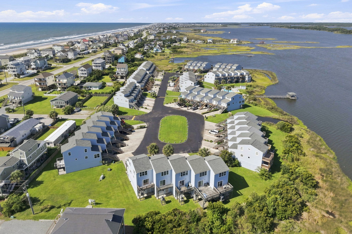 A gorgeous overhead perspective capturing the tranquil waterfront lifestyle and peaceful neighborhood charm.