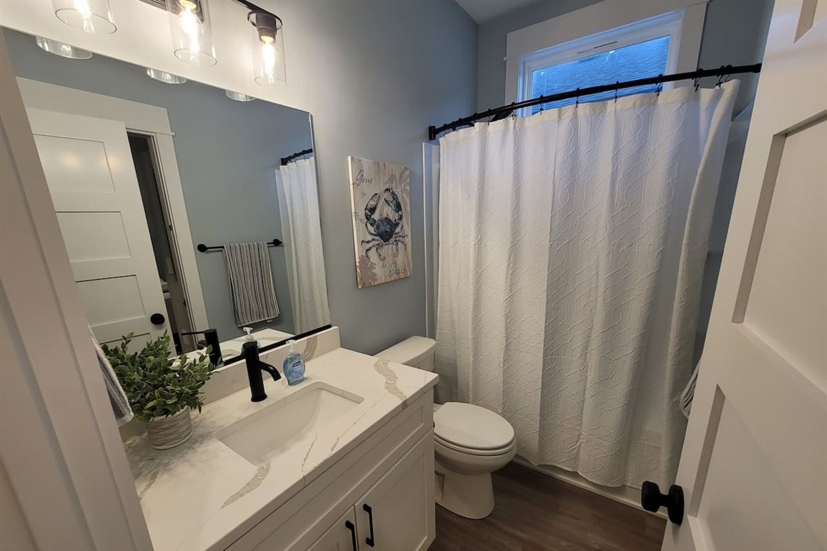 Guest bathroom accessible from the king bedroom and hallway.