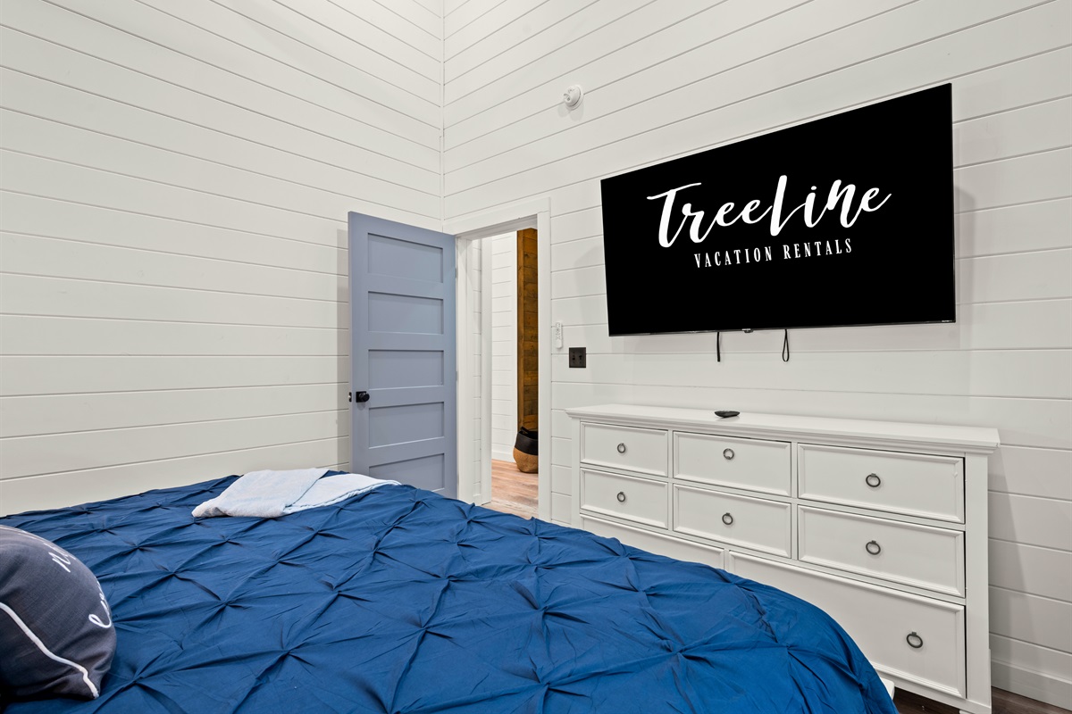 A spacious layout and inviting décor make this bedroom feel both comfortable and relaxing, perfect for settling in after a busy day.