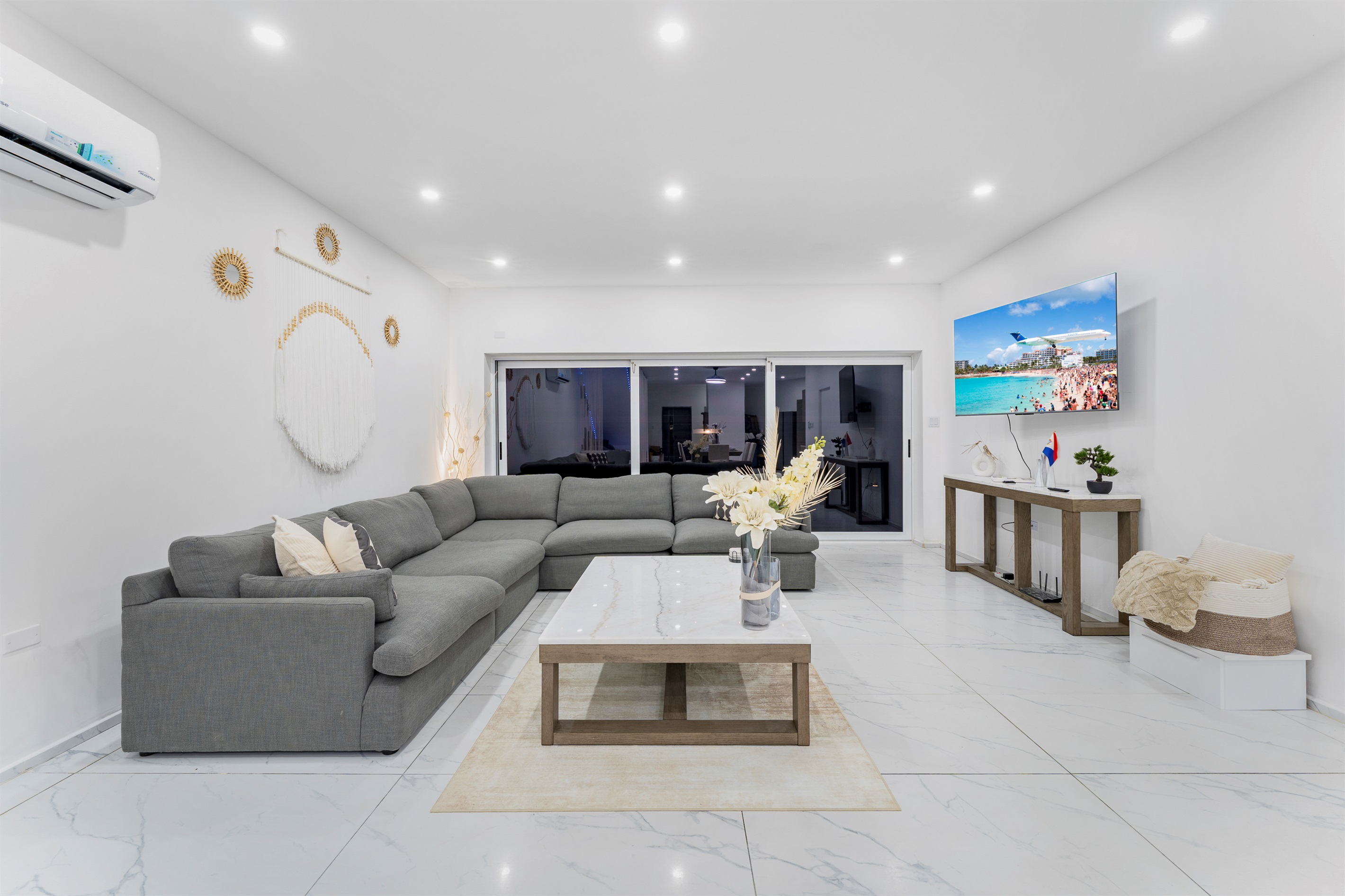 Large sectional sofa and TV facing the patio doors