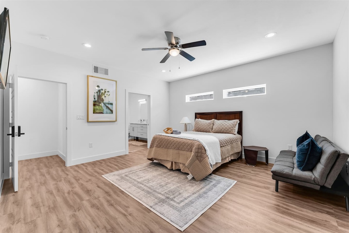 Spacious primary bedroom designed for comfort and relaxation.