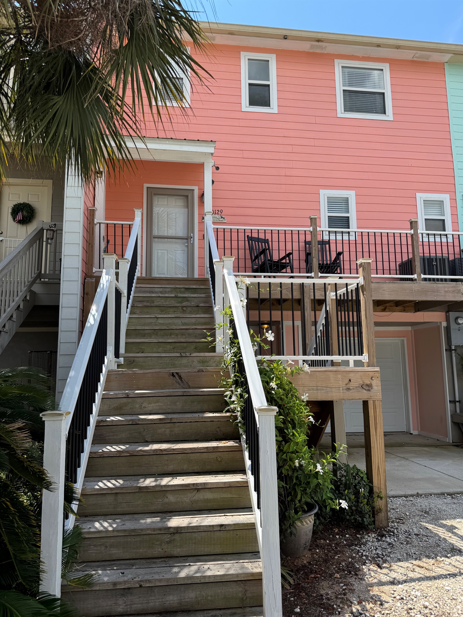 Front of the unit with stairs going to the front door