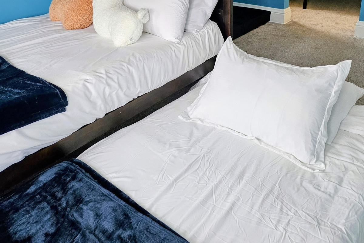 Sleep up to 6 in the pull out twin trundle bed, full over full bunk beds and twin bed in the Machu Picchu Bunk Room.
