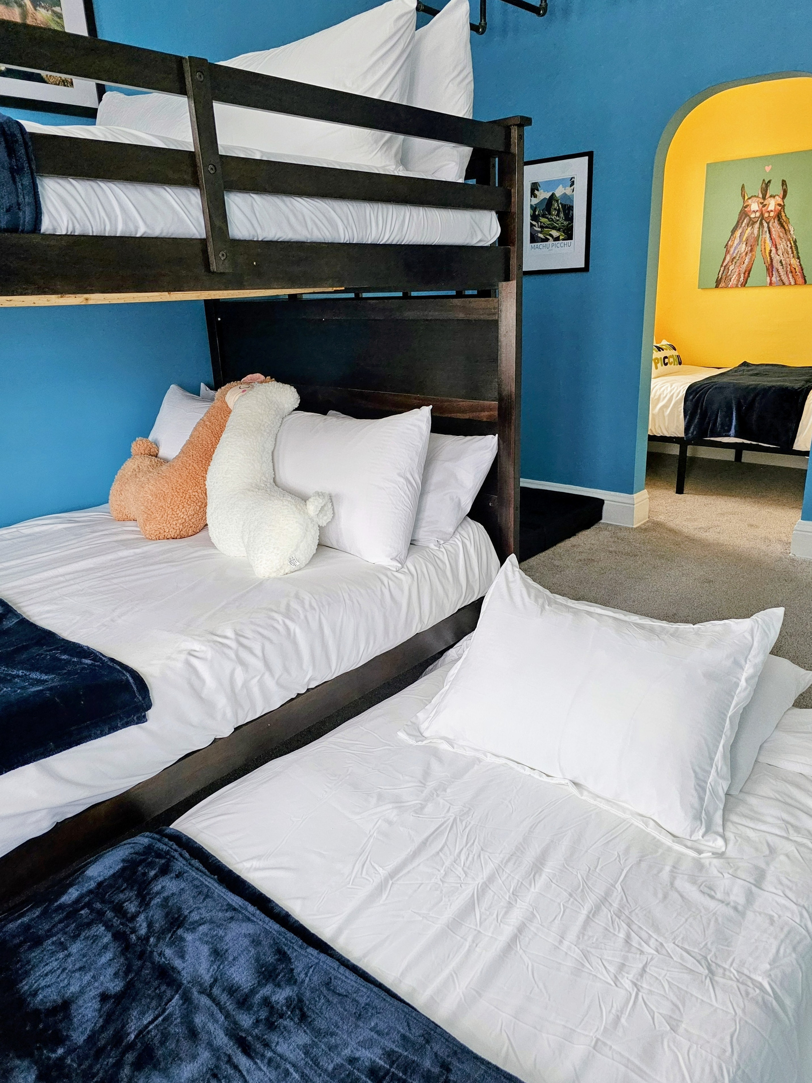 Sleep up to 6 in the pull out twin trundle bed, full over full bunk beds and twin bed in the Machu Picchu Bunk Room.