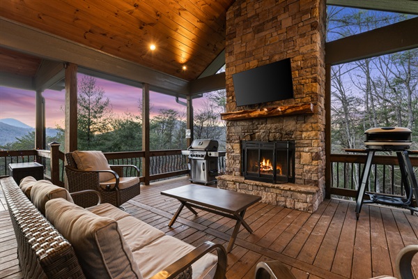 Cozy up by the outdoor fireplace on the party porch, a perfect spot for crisp evenings.