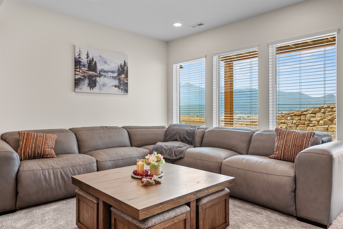 The family room on the lower level has views of the mountains.