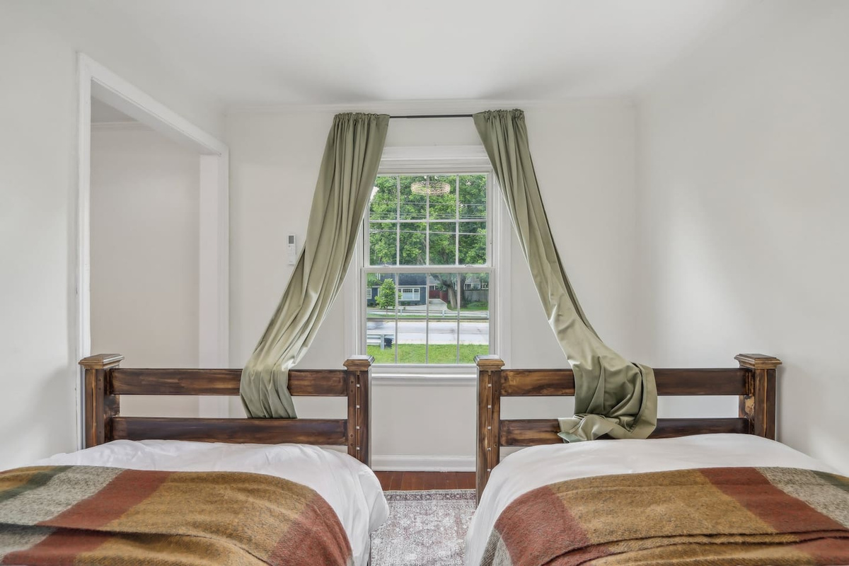 Bright and flexible, Bedroom 4 features two single beds and plenty of natural light for an easy, restful stay.