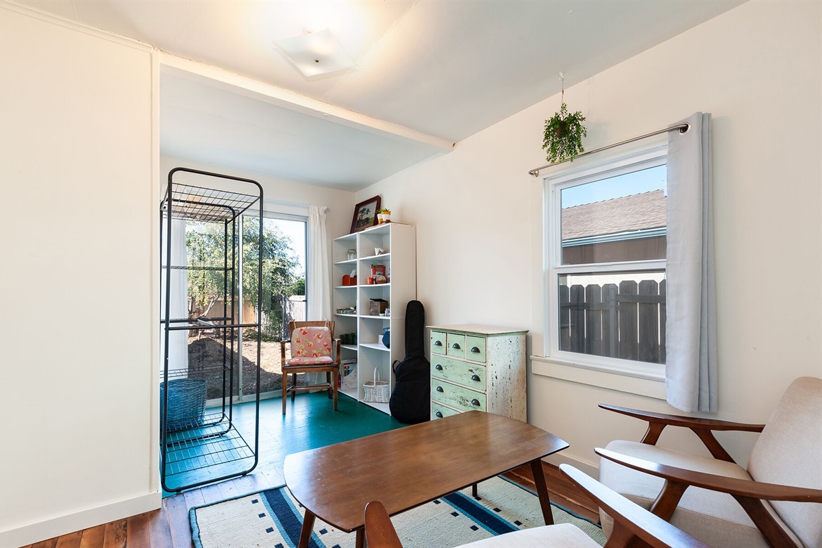 Bedroom - has a sitting area and clothes storage, with the bathroom