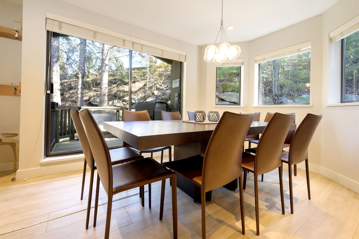 Dining area is surrounded by windows & includes a walk out patio w/ views of Blackcomb.  Dining table seats 10 people and is so close to slopes, you can ski home for lunch. *New in 2024 we upgraded to a custom built Live-Edge Maple Wood Table  
