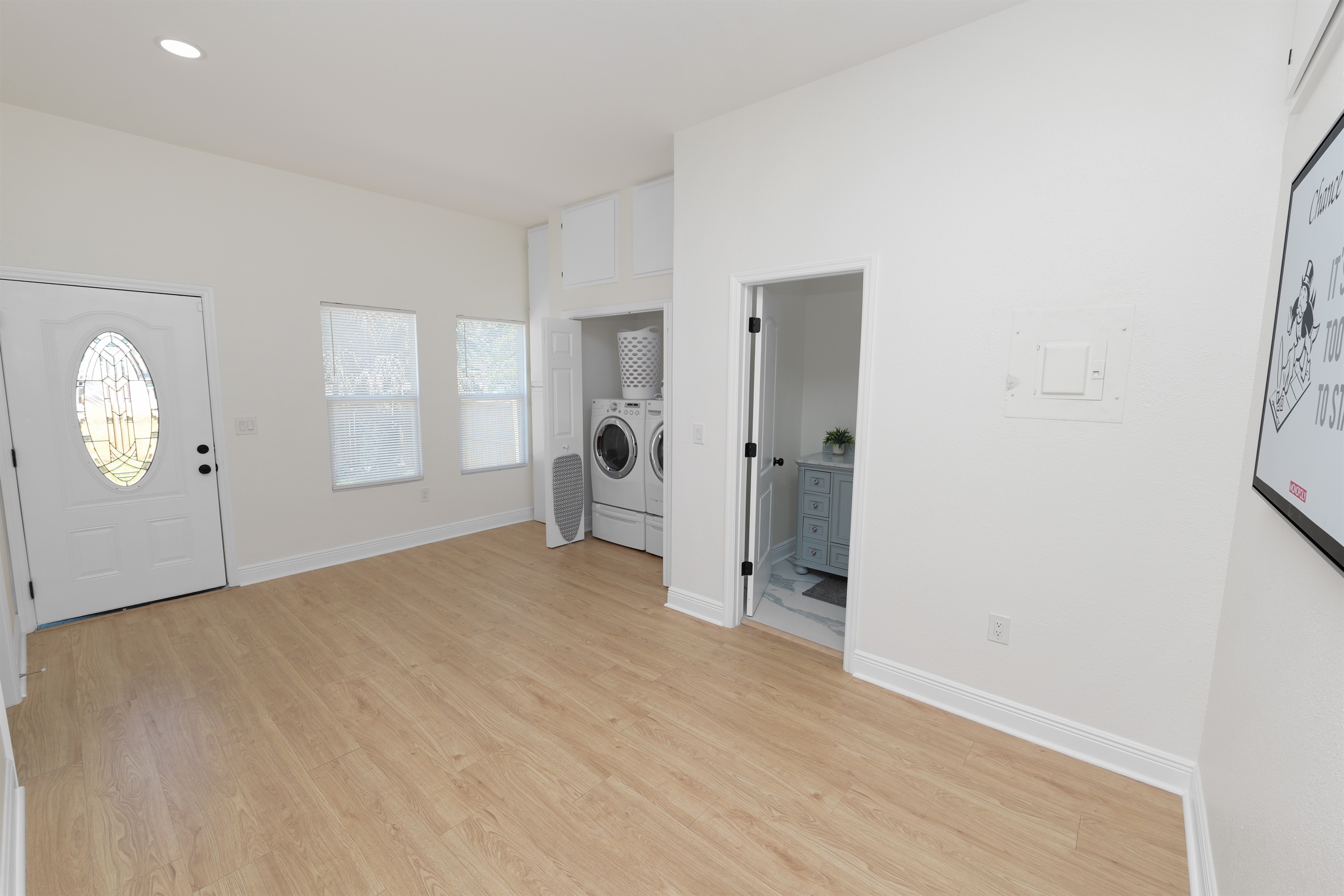 Skip the laundromat! This private laundry closet offers full-size machines, a laundry basket, and all the essentials you need—just steps from the bathroom and bedrooms.