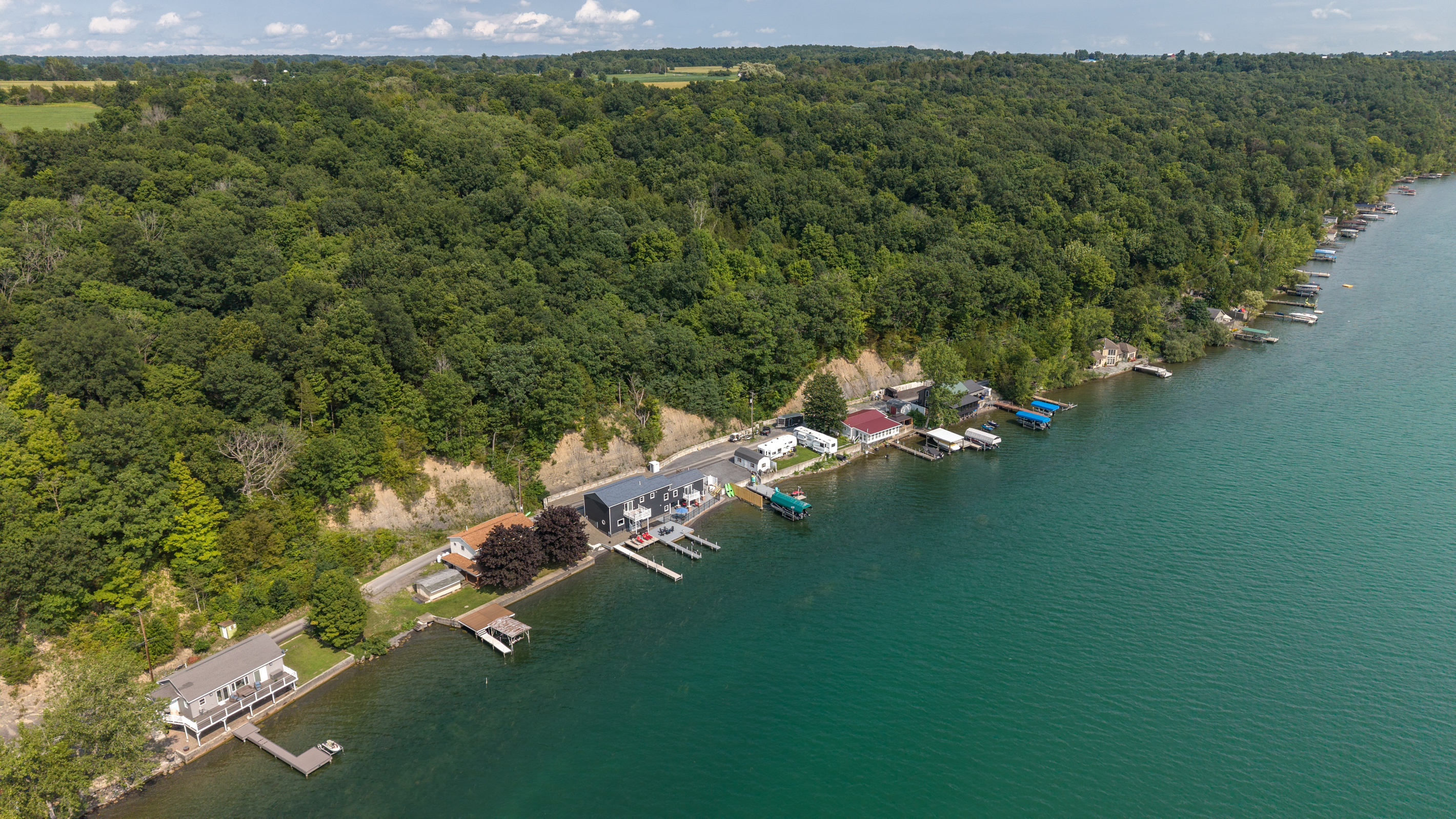 Waterfront neighborhood below the wooded hillside