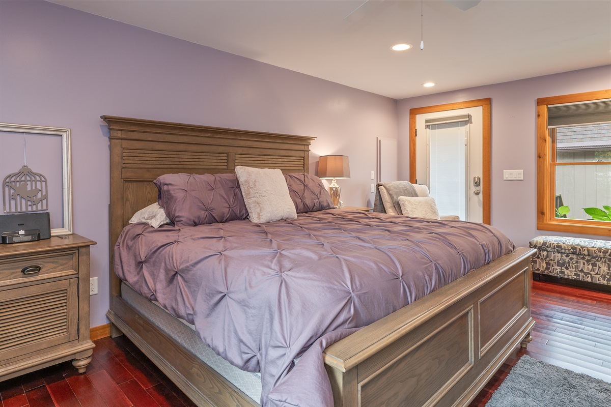 King-size comfort meets natural light in this elegant retreat, offering peaceful vibes and restful nights.