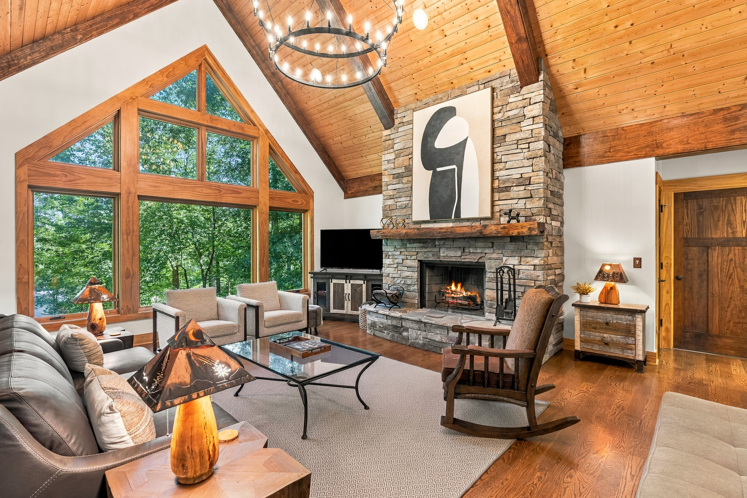 Beautiful living room with large stone, gas fireplace