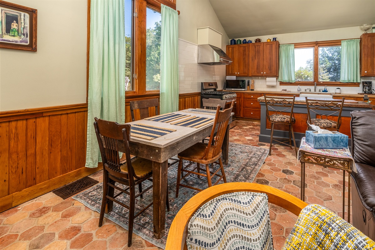 Concrete dining table with seating for four, blending rustic charm with modern style.