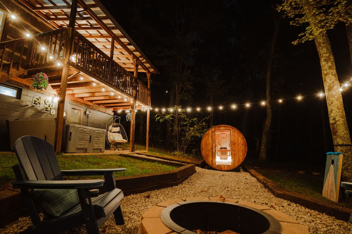Relax around the fire pit, with string lights above