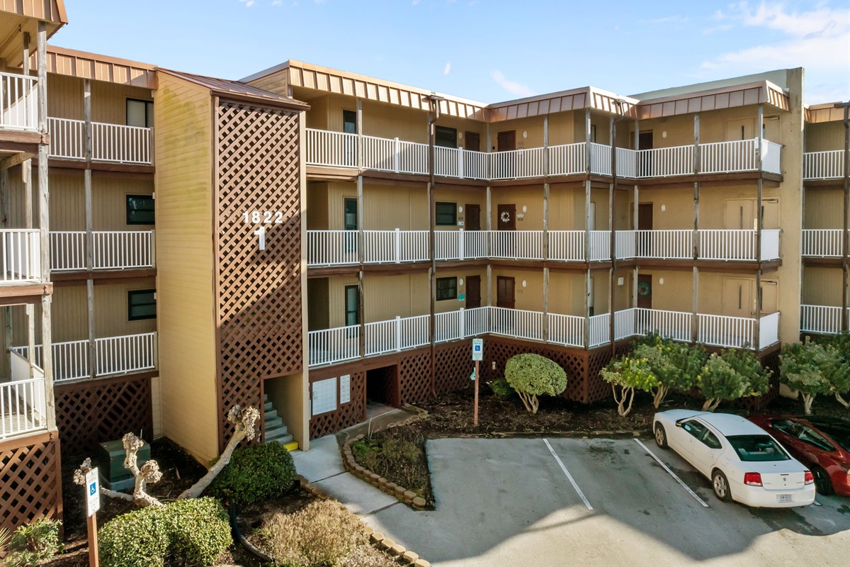 This interior view shows the welcoming layout of Topsail Dunes Building 1, with balconies overlooking the central courtyard area