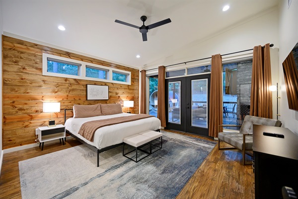 Serene Primary Suite: Modern warmth meets cabin comfort with wood accents and natural light. 