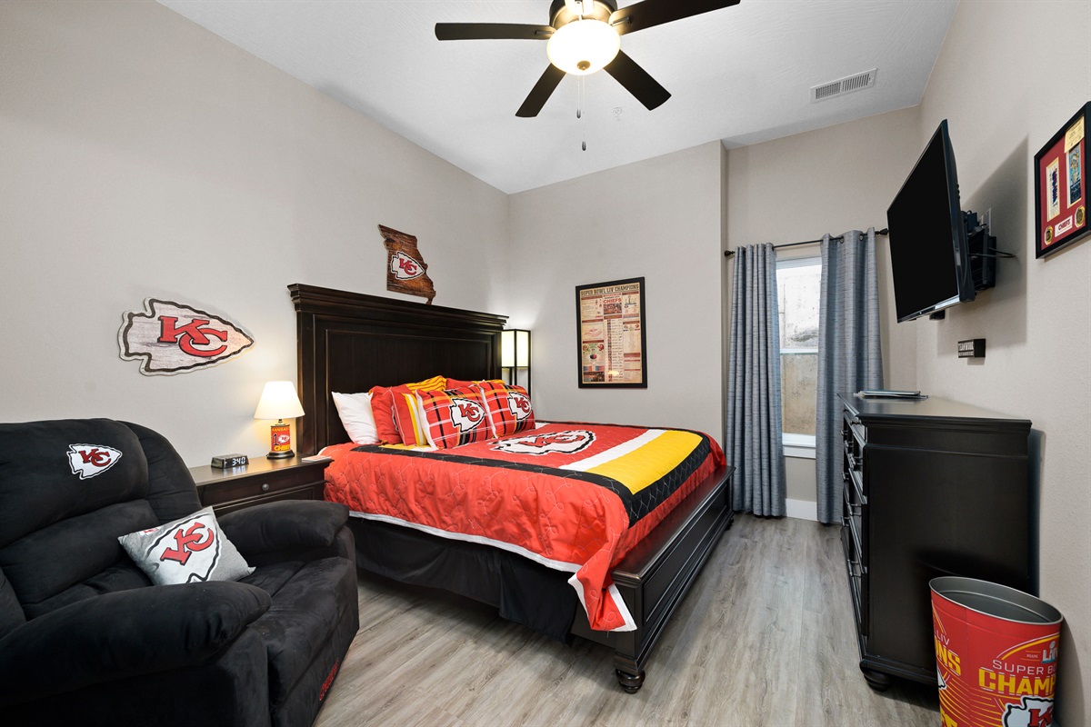 Lower level: Chiefs room with king bed, recliner, and en suite bathroom