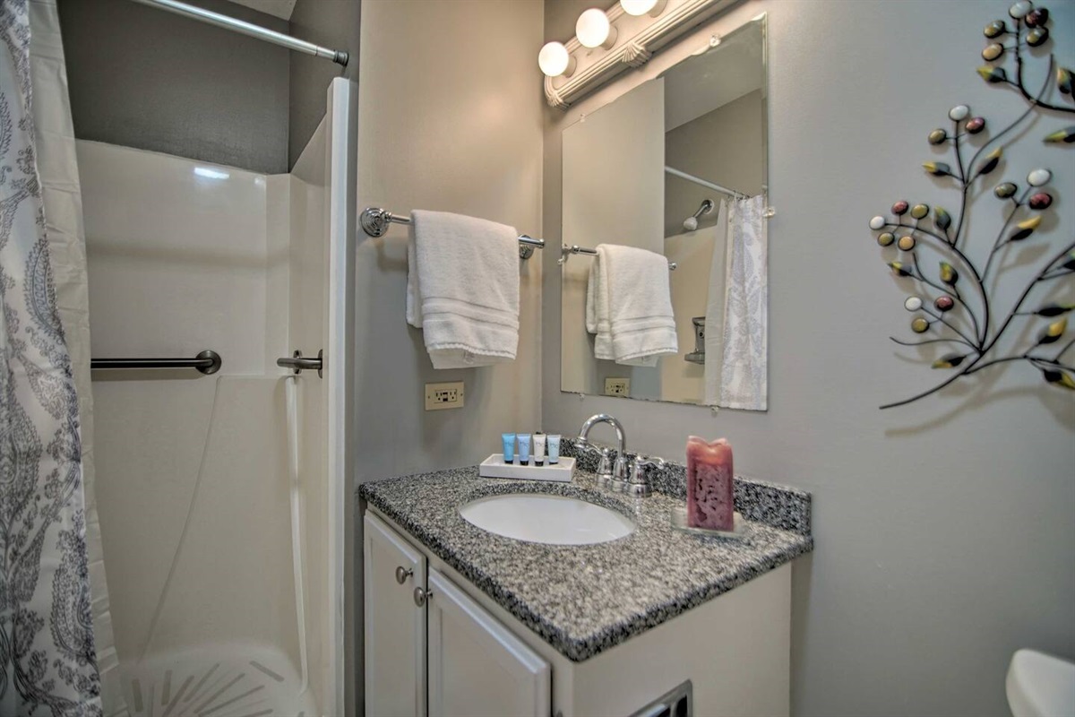 3Bd Unit:  A shower with ADA grab bars for safety, granite countertop sink, ample plush towels, shampoo, conditioner, and a hair blow dryer are available in the ensuite master bathroom for privacy and convenience. 