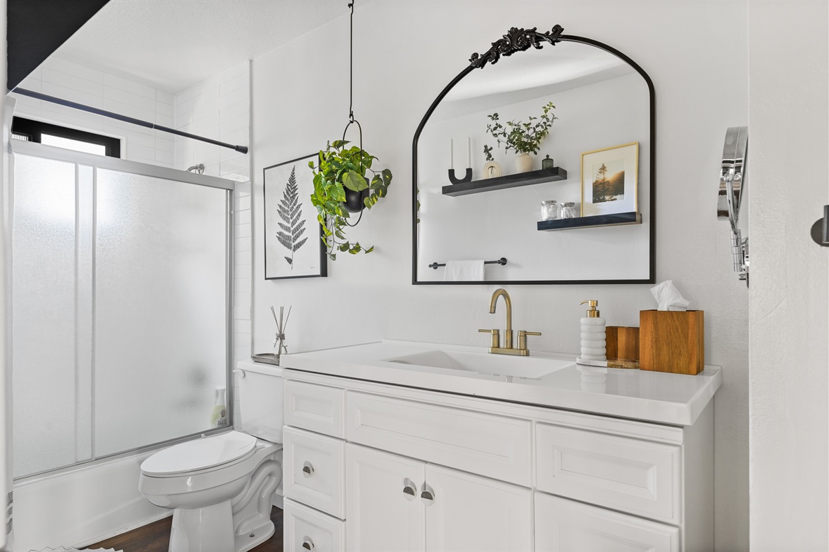 Bathroom 1: Discover a modern, full bathroom on the upper floor, complete with both a full bath and a refreshing shower.