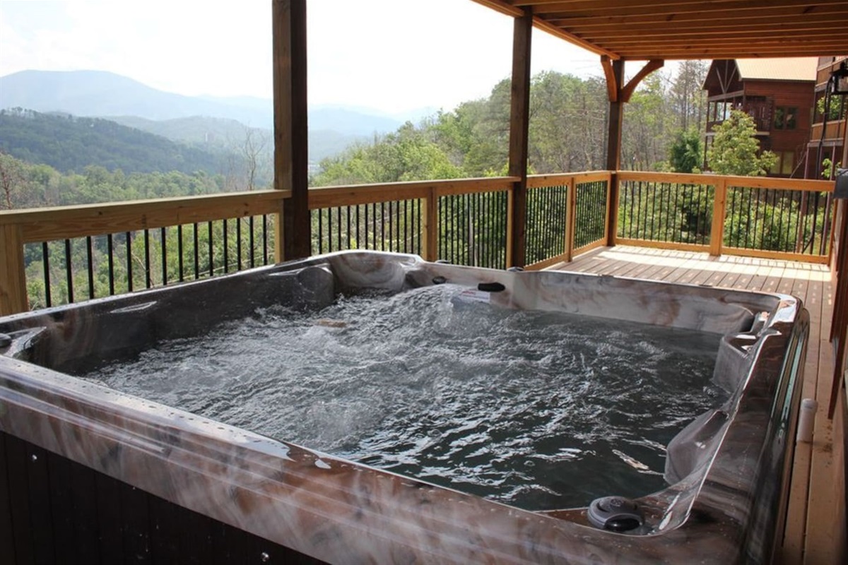 Relax in the hot tub with waterfall and enjoy the view of Mt LeConte 