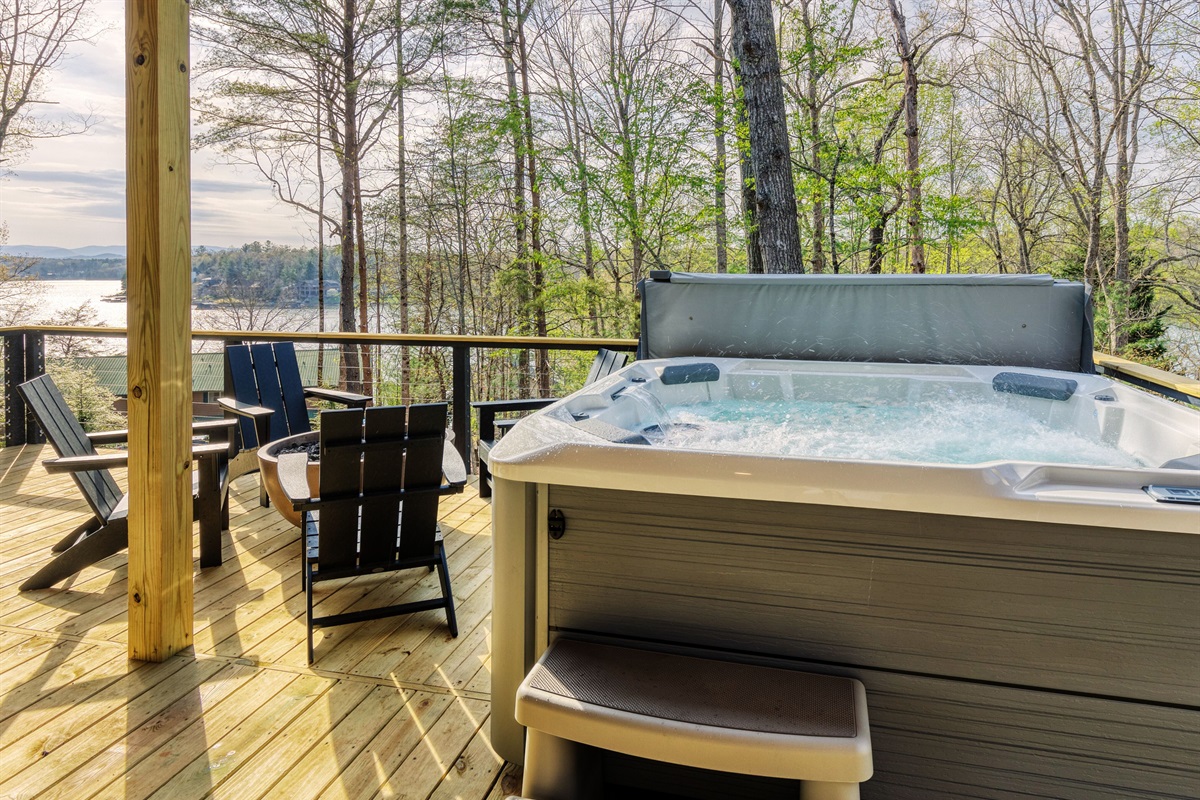A private hot tub and gas fire-pit with lake-mountain views provides the perfect space to relax and unwind.