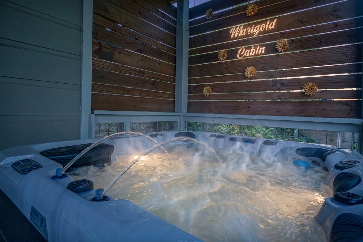 Soak away the day in your own private hot tub on the outdoor deck at Marigold Cabin, a 3-bedroom retreat in Pigeon Forge, Tennessee. With mountain air all around, there's no better way to end an evening than relaxing under the stars.