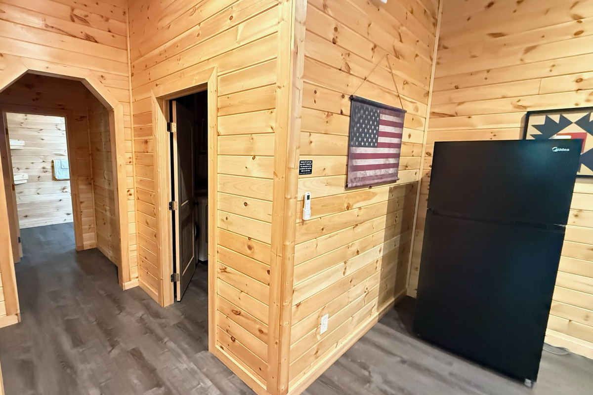 Lower Level Hallway leading to the laundry area, bathroom, and private room