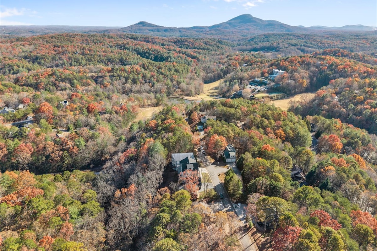 View of the property, beautifully nestled against the mountains—experience breathtaking scenery from above