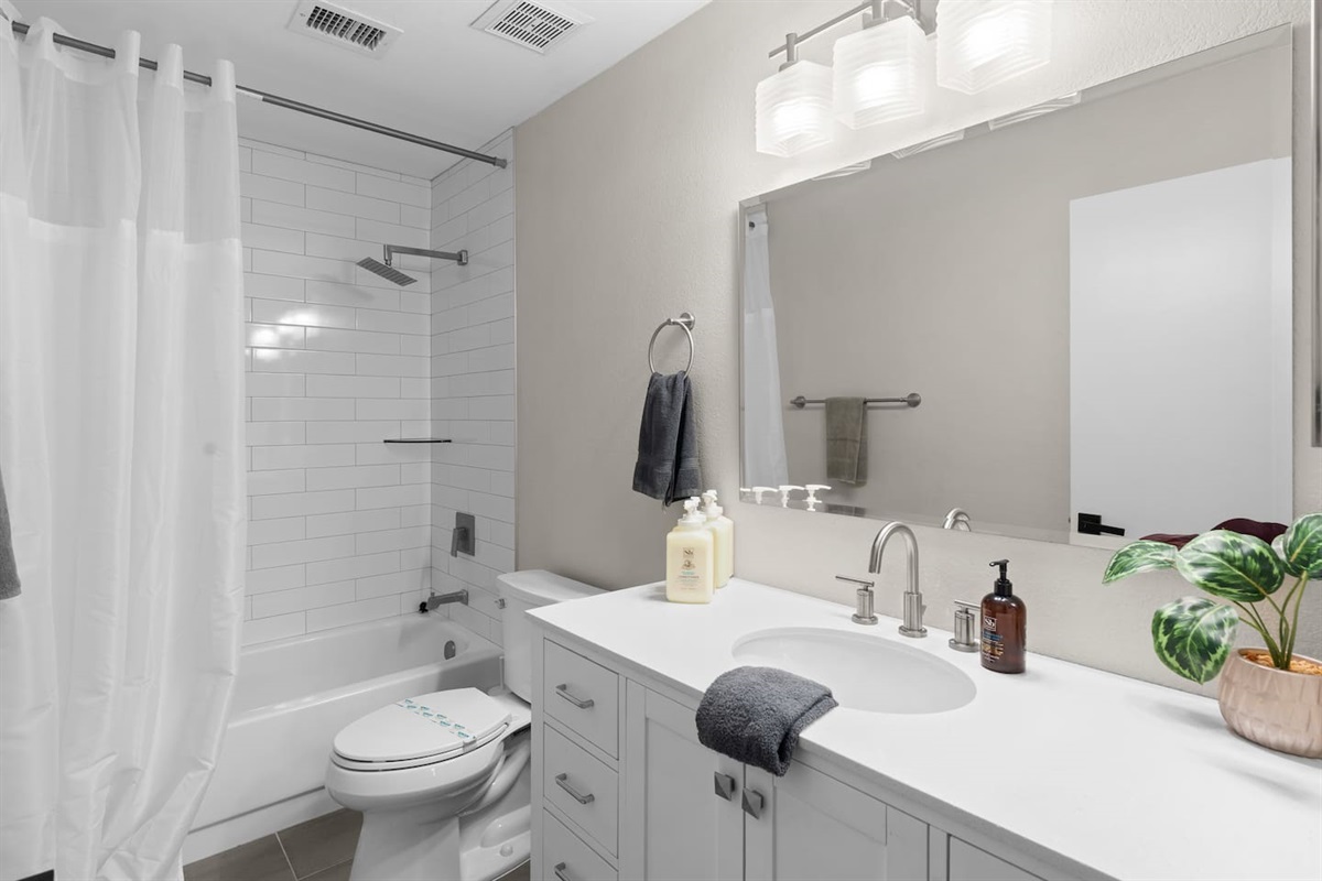 A brand new bathroom invites you to get ready for the day or wind down for the evening.