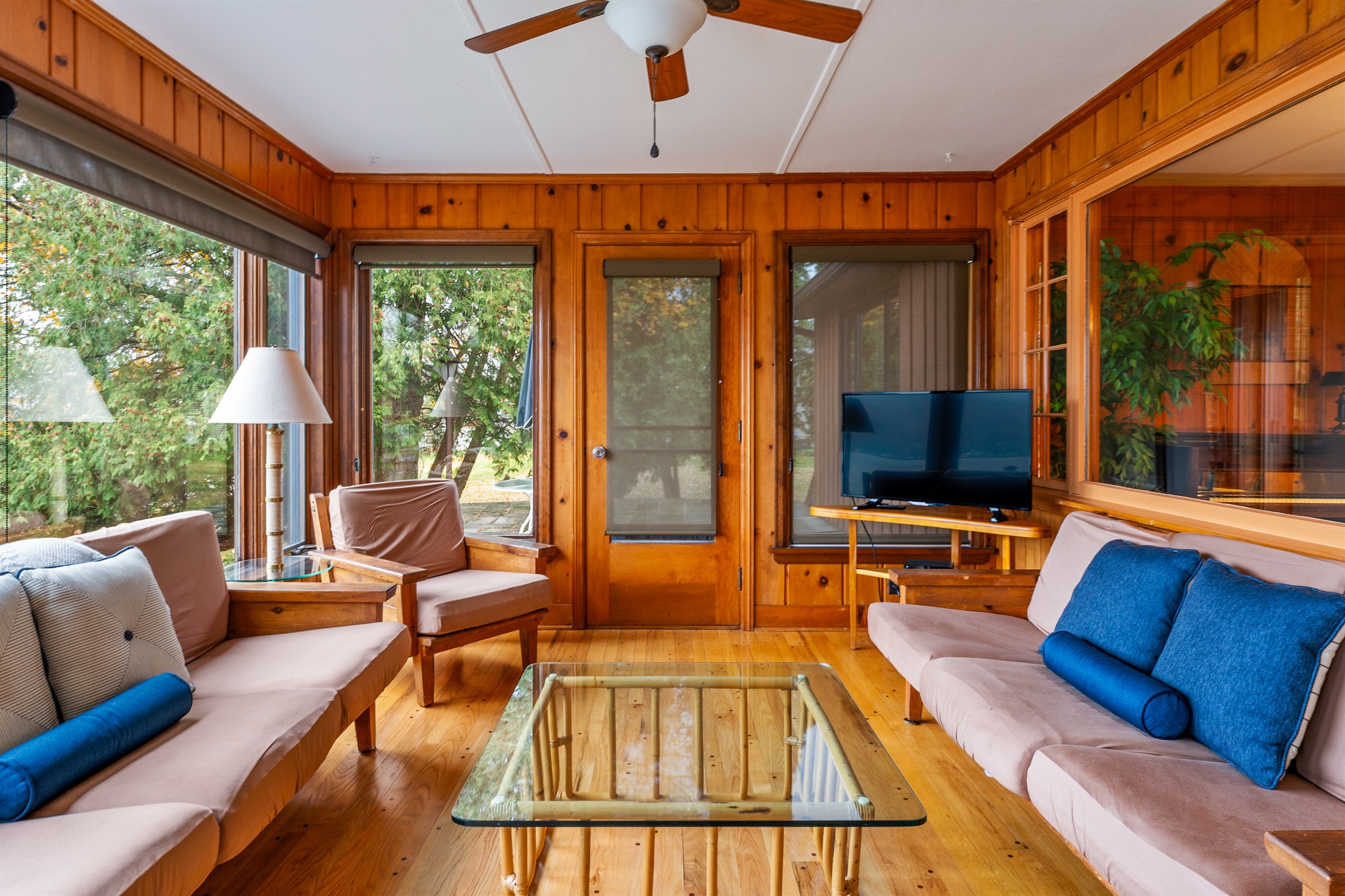 Cozy sun room for morning coffee or evening wine with beautiful views of the lake