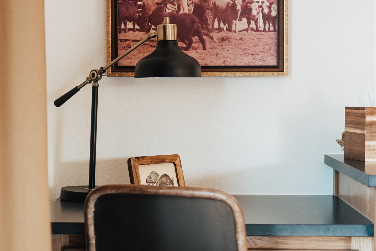 In-suite work desk at the Lazy Spur Suite — high-speed Wi-Fi and a dedicated workspace at Gaines Ranch on the Square, built for remote work and business travel.