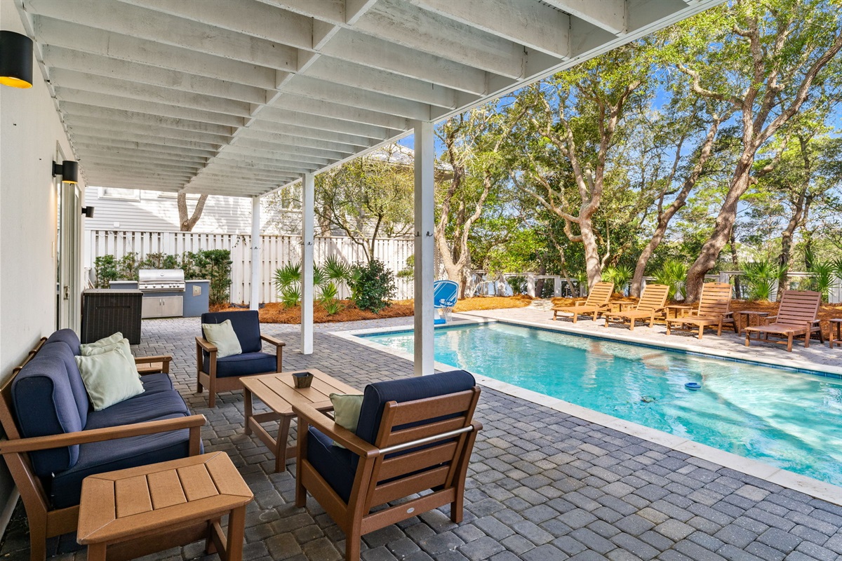 A prime poolside perch for supervising swimmers or masterfully grilling dinner.