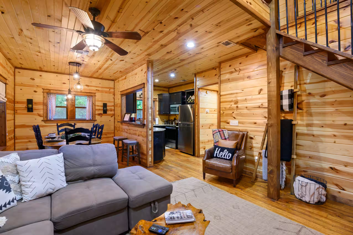Living Room: Enjoy light-filled gatherings in a warm, wooden paradise with vintage charm!