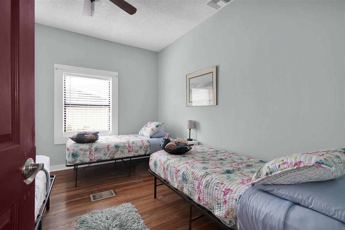 Three twin beds in a room is perfect for kids or single adults. Everyone sleeps better with their own bed