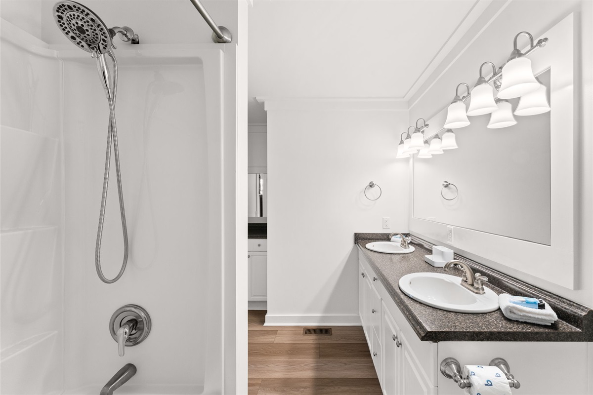 Side A: Private 3rd-floor Master bathroom with a double vanity and walk-in shower.