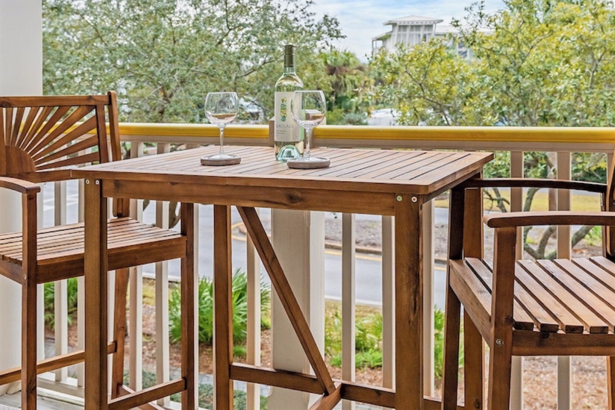 Enjoy wine on your private balcony overlooking Watercolor gardens 