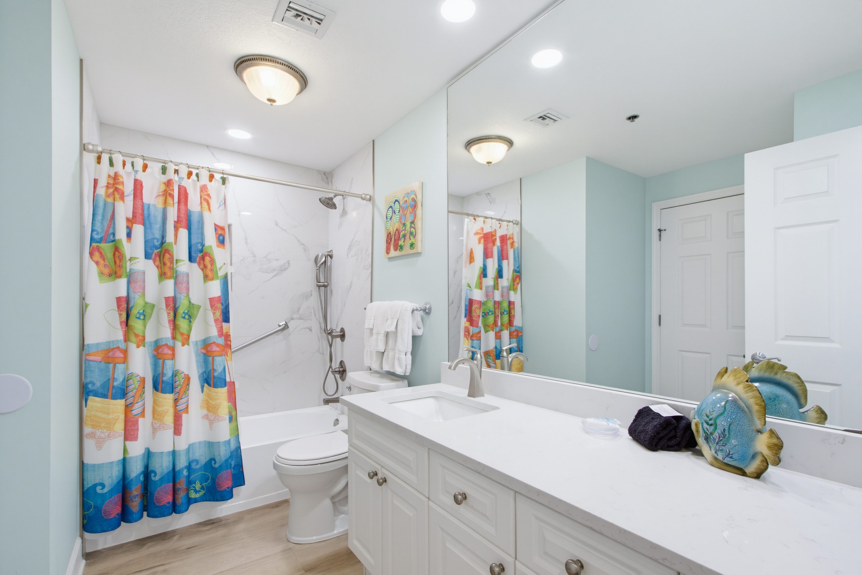 Second bathroom with tub-and-shower combination.